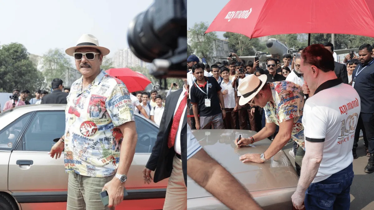 Ravi Shastri pose avec sa voiture Audi vintage lors du salon automobile Raymond 100 Autofest ; Photo